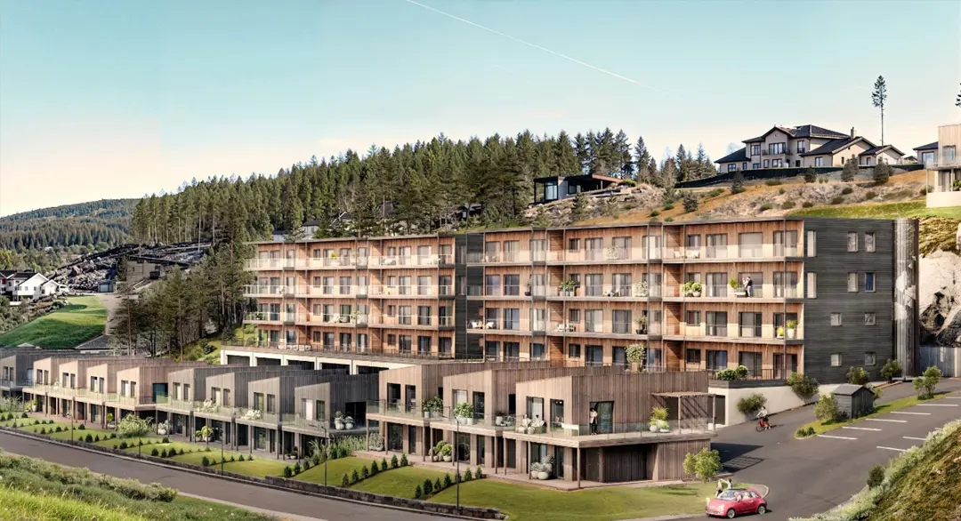 Illustrasjonsfoto av leilighetsbygg i en skråning, men små eneboliger/leiligheter foran.