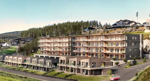 Illustrasjonsfoto av leilighetsbygg i en skråning, men små eneboliger/leiligheter foran.